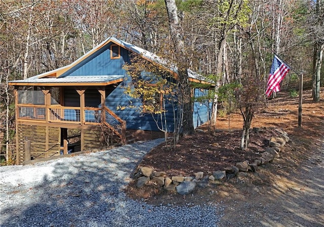 view of front of home featuring a sunroom