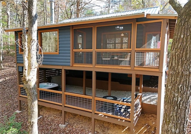 rear view of house with a sunroom