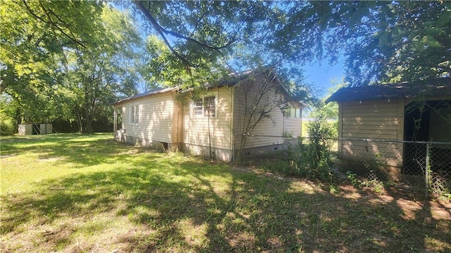 view of home's exterior featuring a yard