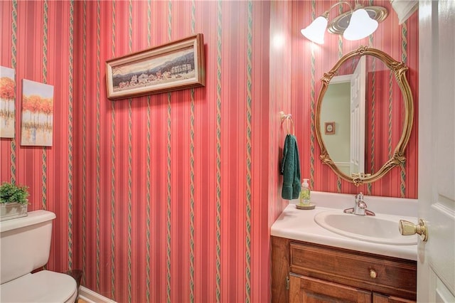 bathroom with vanity and toilet