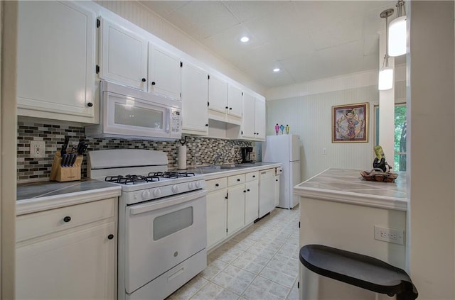 kitchen featuring white cabinets, white appliances, and hanging light fixtures