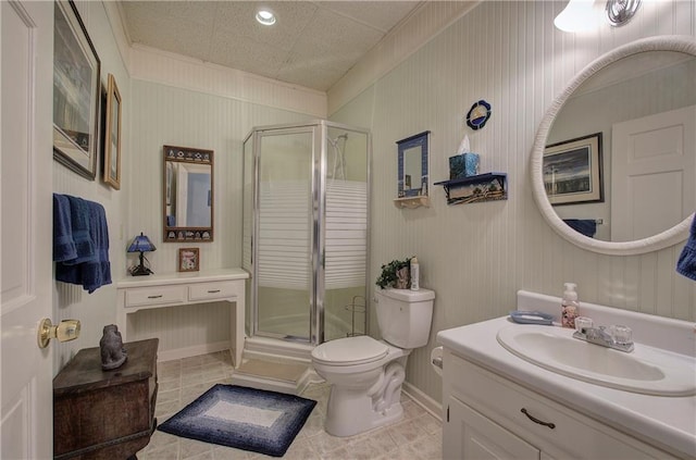 bathroom with tile patterned floors, vanity, toilet, and a shower with shower door