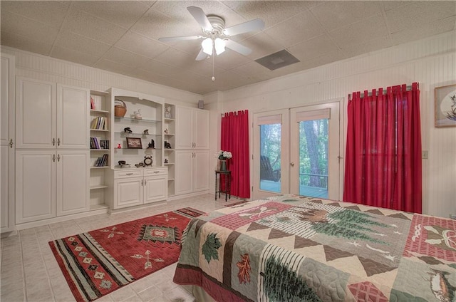 bedroom with ceiling fan, light tile patterned flooring, and access to outside