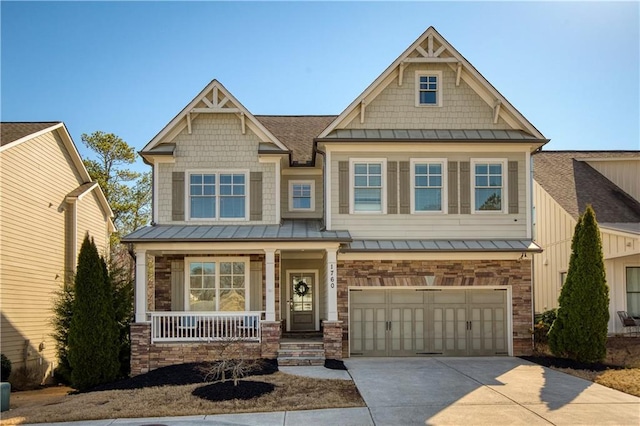 craftsman-style house with a standing seam roof, covered porch, concrete driveway, metal roof, and a garage