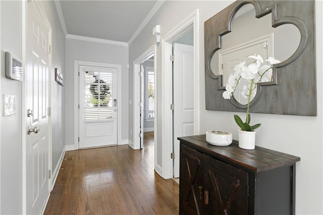 doorway featuring dark wood-style floors, crown molding, and baseboards