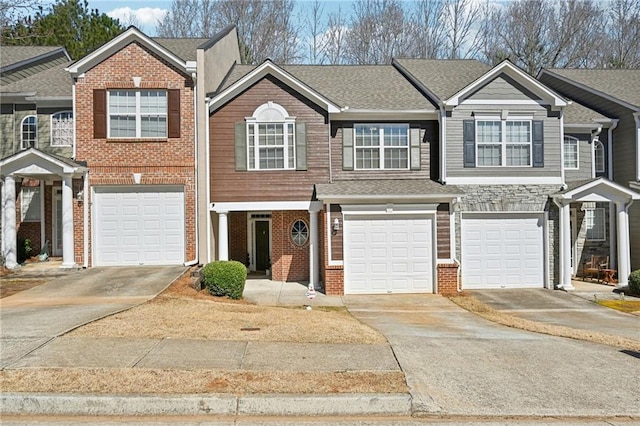 2726 Pierce Brennen Ct, Lawrenceville, GA 30043 - townhome / multi-family property with brick siding, driveway, a shingled roof, and a garage