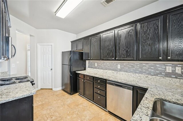 2726 Pierce Brennen Ct, Lawrenceville, GA 30043 - kitchen featuring dark cabinetry, baseboards, visible vents, black appliances, and tasteful backsplash