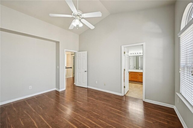 2726 Pierce Brennen Ct, Lawrenceville, GA 30043 - unfurnished bedroom with ensuite bath, wood finished floors, baseboards, and high vaulted ceiling