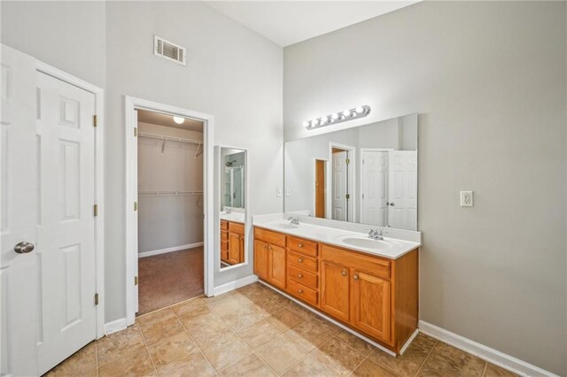2726 Pierce Brennen Ct, Lawrenceville, GA 30043 - full bathroom featuring double vanity, visible vents, baseboards, and a sink