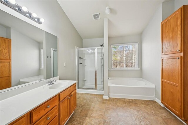 2726 Pierce Brennen Ct, Lawrenceville, GA 30043 - bathroom with visible vents, a garden tub, a stall shower, baseboards, and vanity