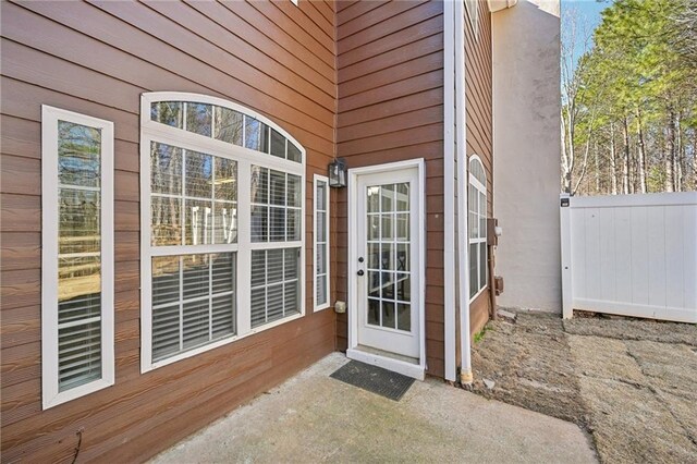 2726 Pierce Brennen Ct, Lawrenceville, GA 30043 - doorway to property with a patio and fence