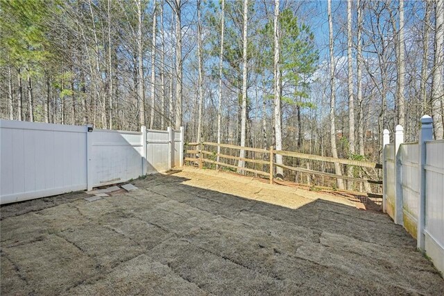 2726 Pierce Brennen Ct, Lawrenceville, GA 30043 - view of yard with a gate and fence