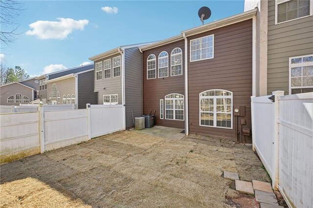 2726 Pierce Brennen Ct, Lawrenceville, GA 30043 - back of property with a patio area, central AC unit, and fence