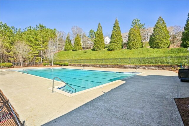 2726 Pierce Brennen Ct, Lawrenceville, GA 30043 - view of swimming pool with a patio, fence, and a fenced in pool