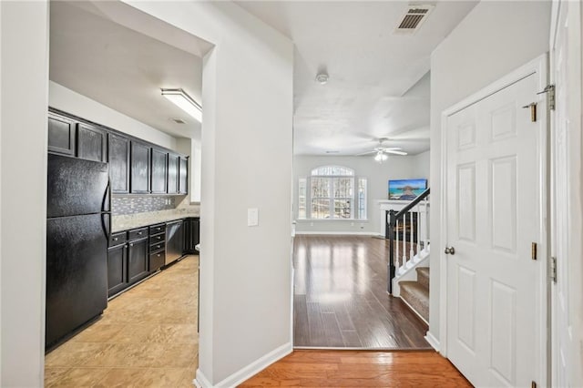 2726 Pierce Brennen Ct, Lawrenceville, GA 30043 - hall featuring visible vents, baseboards, light wood-style flooring, and stairway