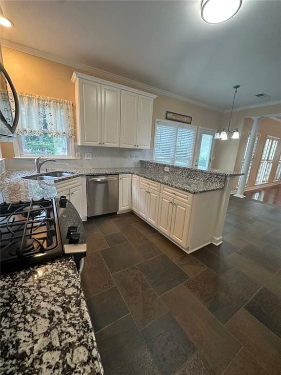 3381 Walkers Ridge Rd, Dacula, GA 30019 - kitchen with dishwasher, a sink, crown molding, gas range, and plenty of natural light