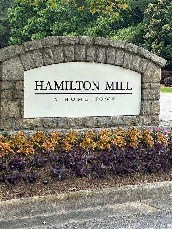 3381 Walkers Ridge Rd, Dacula, GA 30019 - community / neighborhood sign featuring a wooded view