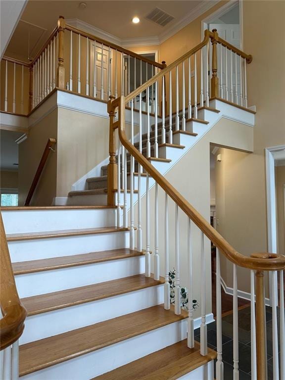 3381 Walkers Ridge Rd, Dacula, GA 30019 - stairway featuring a towering ceiling, ornamental molding, and recessed lighting
