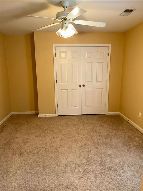 3381 Walkers Ridge Rd, Dacula, GA 30019 - unfurnished bedroom with carpet, a closet, baseboards, and ceiling fan