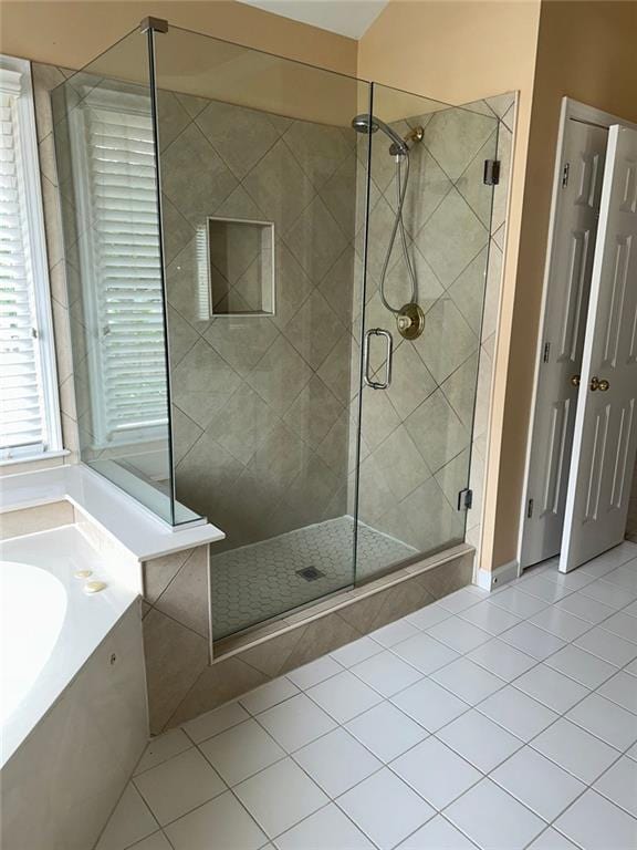 3381 Walkers Ridge Rd, Dacula, GA 30019 - bathroom featuring tile patterned flooring, a stall shower, and a bath
