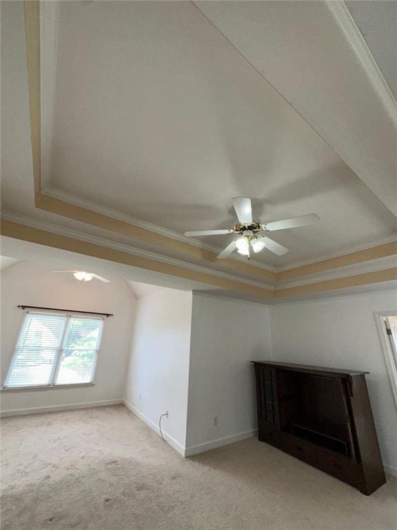 3381 Walkers Ridge Rd, Dacula, GA 30019 - interior space with a raised ceiling, ornamental molding, light carpet, a ceiling fan, and baseboards
