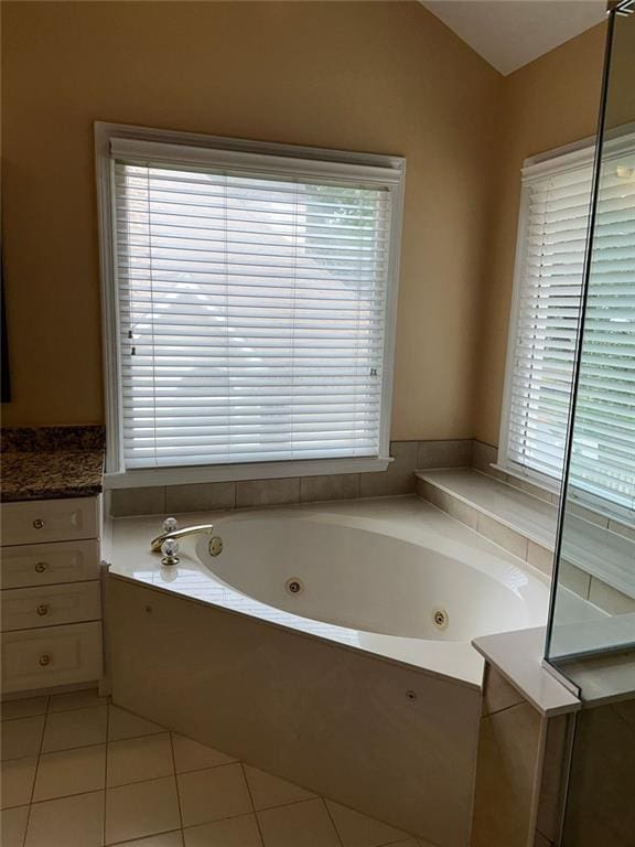 3381 Walkers Ridge Rd, Dacula, GA 30019 - bathroom with a tub with jets and tile patterned floors