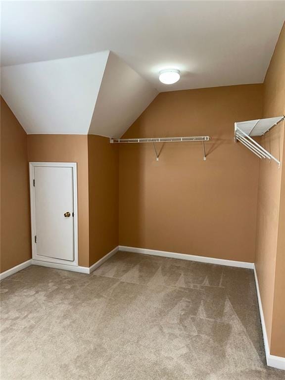3381 Walkers Ridge Rd, Dacula, GA 30019 - walk in closet featuring carpet flooring and vaulted ceiling