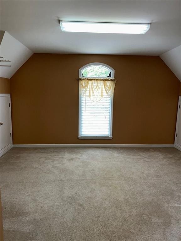 3381 Walkers Ridge Rd, Dacula, GA 30019 - bonus room featuring lofted ceiling, light colored carpet, and baseboards