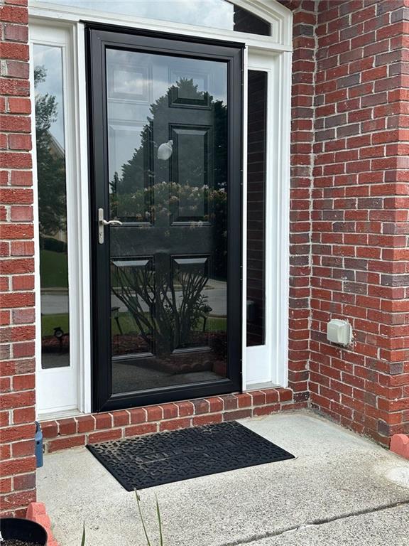3381 Walkers Ridge Rd, Dacula, GA 30019 - doorway to property with brick siding