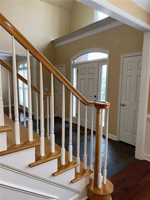 3381 Walkers Ridge Rd, Dacula, GA 30019 - foyer entrance featuring healthy amount of natural light and stairway