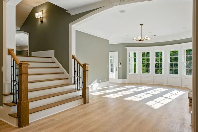 6756 Hedge Row Ln, Gainesville, GA 30506 - foyer with ornamental molding, wood finished floors, a chandelier, stairs, and baseboards