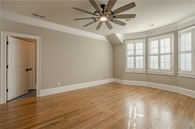 unfurnished room with crown molding, ceiling fan, plenty of natural light, and visible vents