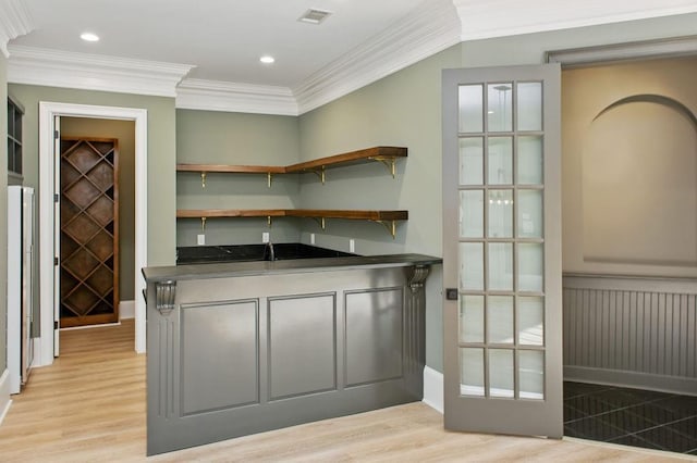 6756 Hedge Row Ln, Gainesville, GA 30506 - indoor wet bar featuring light wood finished floors, ornamental molding, and recessed lighting