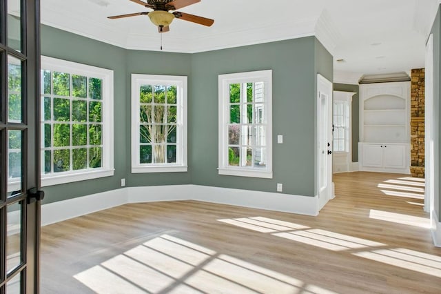 6756 Hedge Row Ln, Gainesville, GA 30506 - unfurnished room with wood finished floors, crown molding, a ceiling fan, and baseboards