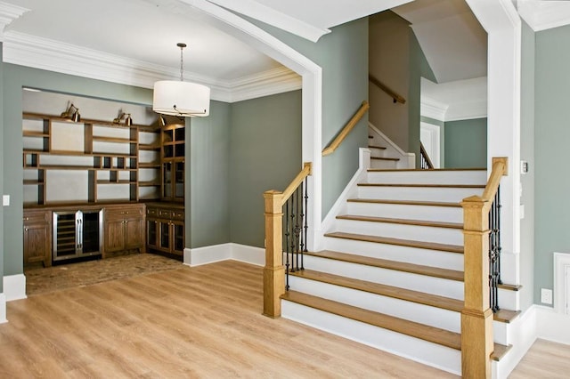 6756 Hedge Row Ln, Gainesville, GA 30506 - stairs with crown molding and wood finished floors