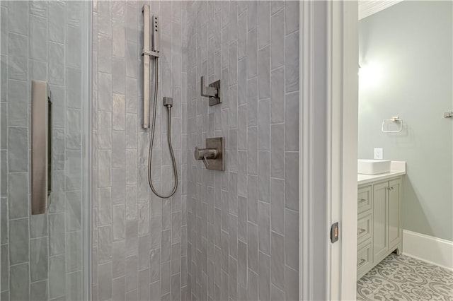 6756 Hedge Row Ln, Gainesville, GA 30506 - bathroom featuring tiled shower, vanity, baseboards, and tile patterned flooring