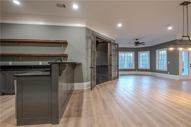 6756 Hedge Row Ln, Gainesville, GA 30506 - kitchen with dark countertops, crown molding, baseboards, ceiling fan, and light wood finished floors