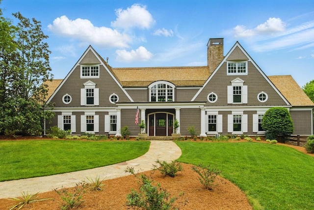 6756 Hedge Row Ln, Gainesville, GA 30506 - shingle-style home with a chimney, a front lawn, and covered porch