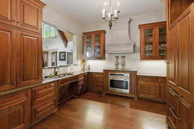 6756 Hedge Row Ln, Gainesville, GA 30506 - kitchen with oven, a sink, tasteful backsplash, dark wood-style flooring, and a chandelier