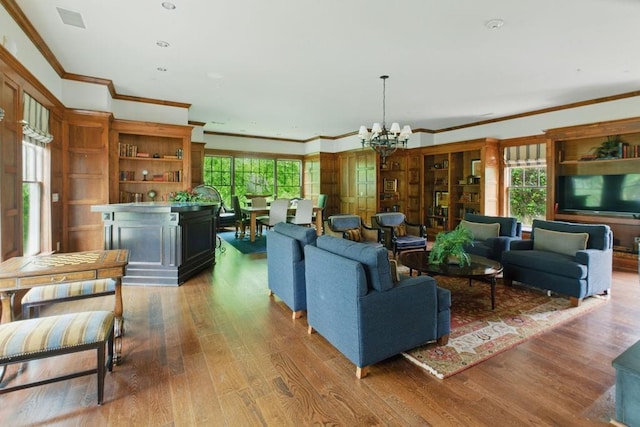 6756 Hedge Row Ln, Gainesville, GA 30506 - living area with a chandelier, crown molding, plenty of natural light, and wood finished floors