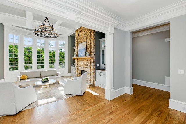 6756 Hedge Row Ln, Gainesville, GA 30506 - living room featuring a chandelier, baseboards, plenty of natural light, wood finished floors, and crown molding