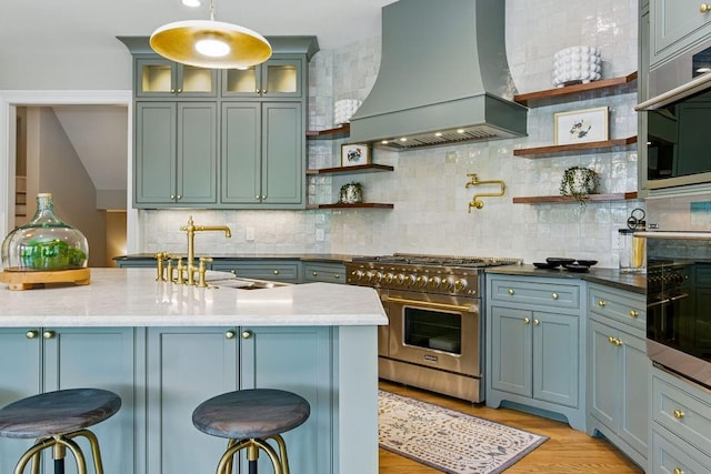 6756 Hedge Row Ln, Gainesville, GA 30506 - kitchen with custom range hood, appliances with stainless steel finishes, open shelves, and a sink