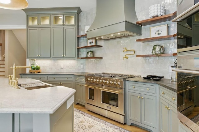6756 Hedge Row Ln, Gainesville, GA 30506 - kitchen with double oven range, premium range hood, open shelves, and tasteful backsplash
