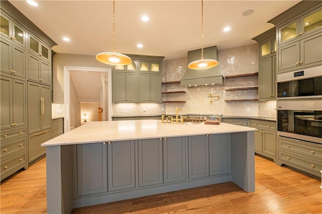 kitchen featuring backsplash, open shelves, custom exhaust hood, and double oven