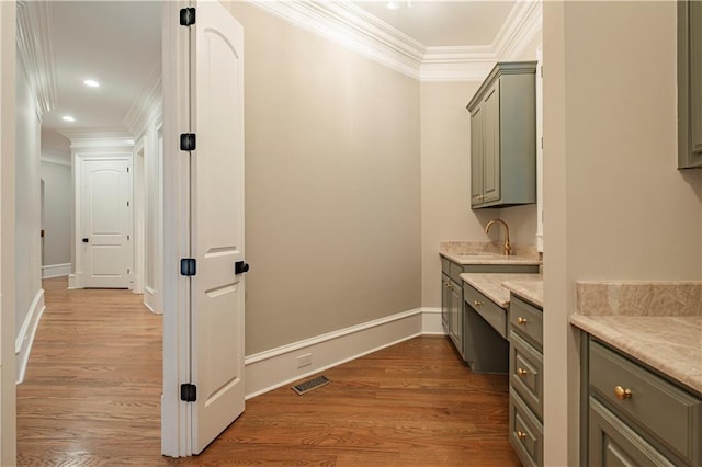 bathroom featuring crown molding, wood finished floors, and visible vents