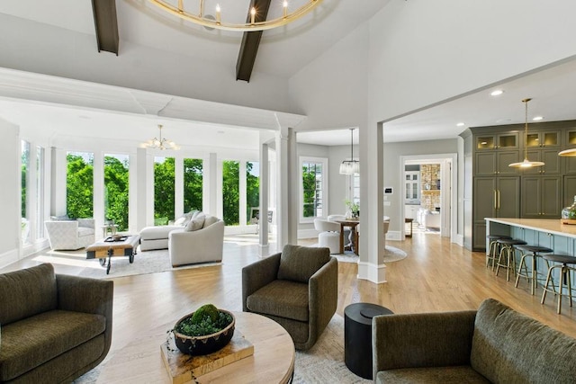 6756 Hedge Row Ln, Gainesville, GA 30506 - living area with a chandelier, light wood-style floors, high vaulted ceiling, baseboards, and recessed lighting