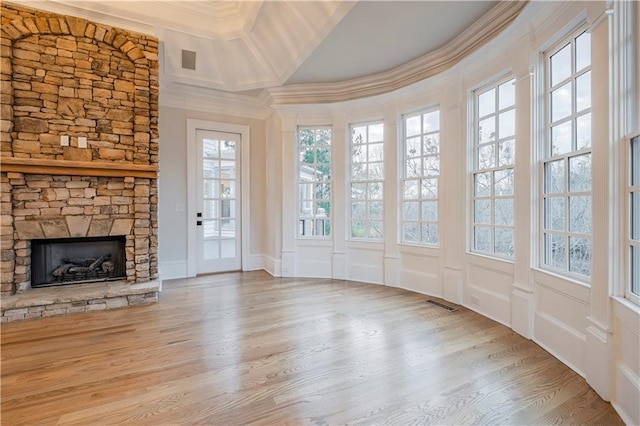 interior space featuring plenty of natural light, visible vents, and beamed ceiling