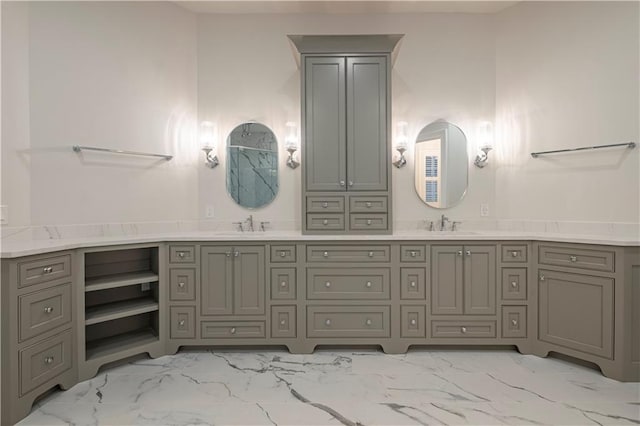 full bath with double vanity, a sink, and marble finish floor
