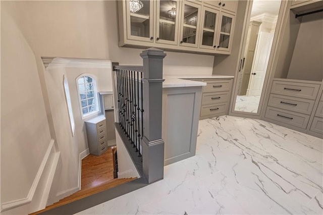 interior space featuring marble finish floor