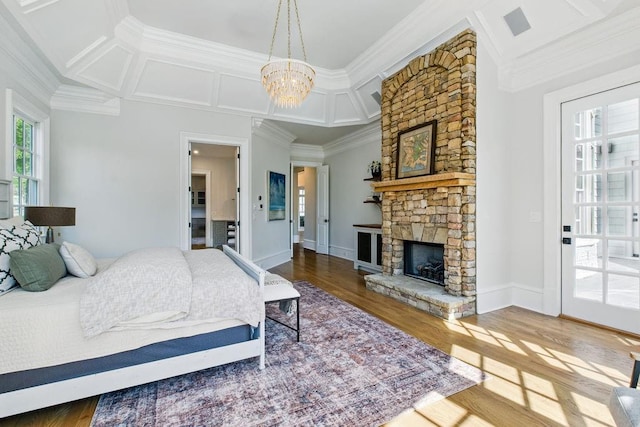 6756 Hedge Row Ln, Gainesville, GA 30506 - bedroom with ornamental molding, wood finished floors, a fireplace, a chandelier, and coffered ceiling